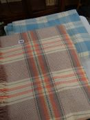 Checkered multi-coloured Welsh blanket and a similar in blue and white