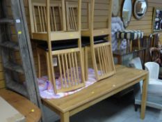 Modern light wood dining table and four chairs