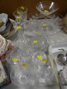 Quantity of cut glass tableware including vases and a large flared rim fruit bowl