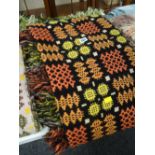 Black ground multi-coloured geometric patterned Welsh blanket