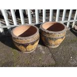 Pair of large amber glazed dragon decorated garden plant pots (outside)