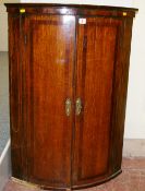 A VICTORIAN OAK & MAHOGANY BOW FRONT WALL HANGING CORNER CUPBOARD with boxwood line stringing