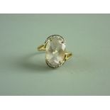 A NINE CARAT GOLD OVAL ROSE QUARTZ DRESS RING, 5 grms gross