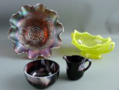 FOUR ITEMS OF VINTAGE COLOURED GLASSWARE including a carnival glass fruit bowl, a twin handled