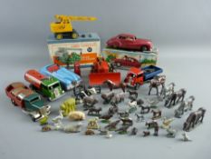 A VINTAGE CASE OF TINPLATE & DIECAST ETC TOY VEHICLES & ANIMALS by Triang, Dinky, Britain's etc