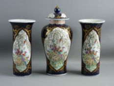 AN ORIENTAL THREE PIECE GARNITURE SET of pair of chimney vases and centre baluster vase with knopped