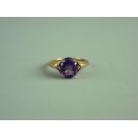 A NINE CARAT GOLD OVAL AMETHYST DRESS RING, 2.8 grms gross, size 'R/S'