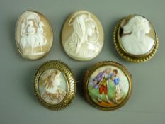 A NINE CARAT GOLD FRAMED OVAL CAMEO BROOCH of three figures with safety chain, three other cameo