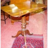 AN OBLONG TILT TOP MAHOGANY TRIPOD TABLE with centre turned column