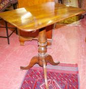 AN OBLONG TILT TOP MAHOGANY TRIPOD TABLE with centre turned column