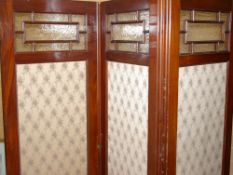 A CIRCA 1900 MAHOGANY THREE FOLD DRESSING SCREEN, the upper portions with beaded glass panels