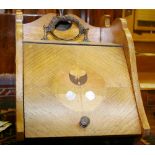 AN OAK ART NOUVEAU COAL SCUTTLE with interior liner and scoop, the lidded section with multi-wood