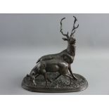 A BRONZED SPELTER STAG & DOE GROUP, modelled in animated pose on a naturalistic oval base,