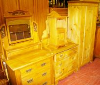TWO STRIPPED PINE EDWARDIAN DRESSING TABLES, a single door wardrobe and a later bedside cabinet