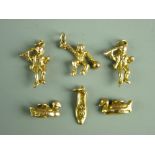 A NINE CARAT GOLD SHOE CHARM, 1.9 grms, two duck charms (unmarked, believed gold) 6 grms, a