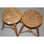 A CIRCULAR PAIR OF FLORAL CARVED STOOLS on bobbin turned supports and urn conjoined cross