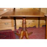 A VICTORIAN MAHOGANY TILT TOP BREAKFAST TABLE, the rectangular top with moulded edge, supported on a