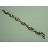 A BOXED 925 SILVER MACKINTOSH DESIGN BRACELET having six links, each link with a Mackintosh rose,