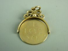 A NINE CARAT GOLD COIN TYPE FOB with hieroglyphics, 3.5 grms