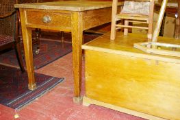 AN OBLONG TOPPED PINE TABLE on square tapered corner supports and a lidded pine blanket chest