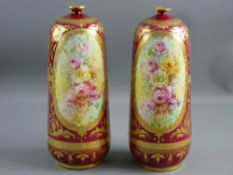 A PAIR OF CRIMSON GROUND ROYAL BONN VASES, slightly tapered with narrow necks, heavily decorated