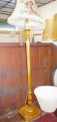 A GOOD EARLY 20th CENTURY WALNUT STANDARD LAMP having turned top and lower sections with a