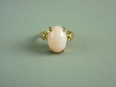 A NINE CARAT GOLD DRESS RING WITH OVAL PINK OPAL, 14.7 grms gross, size 'N'