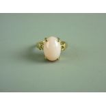 A NINE CARAT GOLD DRESS RING WITH OVAL PINK OPAL, 14.7 grms gross, size 'N'