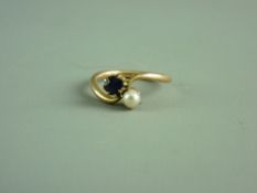 A LADY'S FIFTEEN CARAT GOLD AMETHYST & PEARL CROSSOVER RING, size 'M/N', 3.4 grms gross