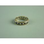 A NINE CARAT WHITE GOLD SAPPHIRE ETERNITY RING, 2.6 grms, size 'O/P'