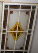 AN ETCHED & STAINED GLASS WINDOW PANEL having a central four sectional panel with stylized display