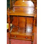 A VICTORIAN MAHOGANY WHATNOT CANTERBURY having a shelved back rail, a three sectional base shelf