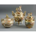 A WELL DECORATED SATSUMA FIGURAL TWO HANDLED BOWL with pierced cover on three feet, 10 cms diameter,