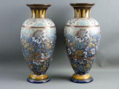 A PAIR OF DOULTON LAMBETH BALUSTER VASES having a gilt and lustre highlighted floral pattern in