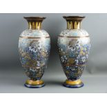 A PAIR OF DOULTON LAMBETH BALUSTER VASES having a gilt and lustre highlighted floral pattern in