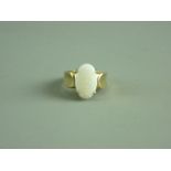 A NINE CARAT GOLD CLOUDY WHITE OPAL DRESS RING, 15 mm long, 5 grms gross, size 'O'