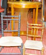TWO VINTAGE RUSH SEATED CHILD'S CHAIRS with bobbin turned backs and front supports, 58.5 cms high,