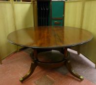 ARTHUR BRETT & SONS, NORWICH, A FINE CIRCULAR CUBAN MAHOGANY DINING TABLE made by this Company and