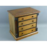 A CIRCA 1900 MAHOGANY & EBONIZED APPRENTICE CHEST of four long drawers with turned wooden knobs