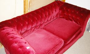 A LATE VICTORIAN/EARLY EDWARDIAN PLUSH BURGUNDY THREE SEATER CHESTERFIELD SETTEE