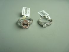 A NINE CARAT WHITE GOLD MORGANITE & TOPAZ DRESS RING, 3.4 grms gross, size 'N' and a nine carat