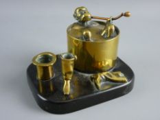 A BRASS INKSTAND in the form of a monkey jockey taking a bath (the lid of the cylindrical