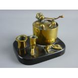 A BRASS INKSTAND in the form of a monkey jockey taking a bath (the lid of the cylindrical