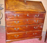 A GEORGIAN MAHOGANY FALL FRONT BUREAU having four long lower drawers on corner bracket feet, the