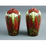 A PAIR OF MINTON SECESSIONIST VASES with stylized tube line decoration on a plum ground with ovoid