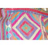 A SUZANI KILIM RUNNER, a colourful woven rug with block diamond pattern, 144 x 52 cms