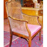 A SMALL MAHOGANY FRAMED BERGERE ELBOW CHAIR