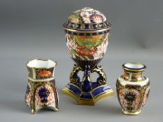 TWO SMALL ROYAL CROWN DERBY IMARI DECORATED MINIATURE VASES, each 6 cms high and a Royal Crown Derby