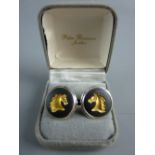 A PAIR OF CIRCULAR BLACK ENAMEL WEDGWOOD CUFFLINKS, each decorated with a gilt horse's head