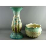 A VICTORIAN MAJOLICA POTTERY JARDINIERE ON STAND, colourful floral and leaf tube line pattern on a